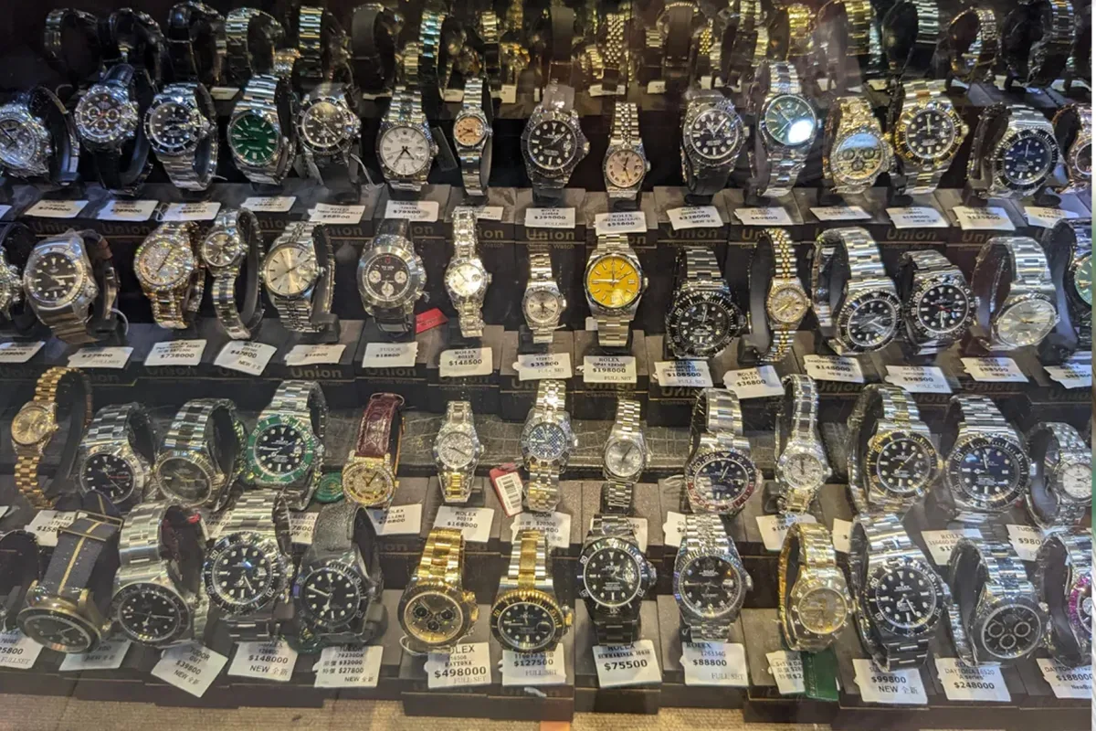 Collection of Rolex watches with different models and colors.