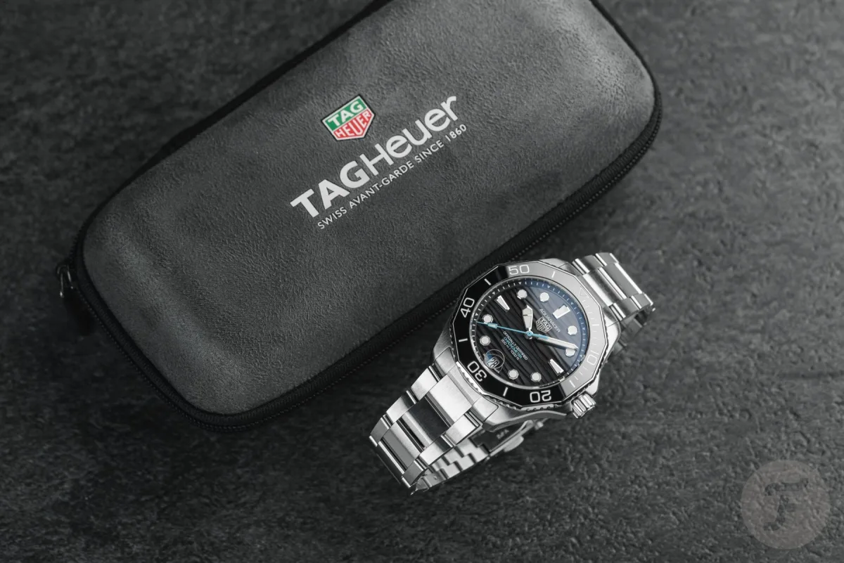 TAG Heuer Aquaracer on wrist with steel bracelet