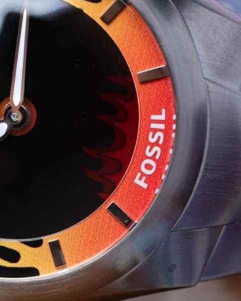 Orange flame-effect dial of Fossil Y2K Big Tic