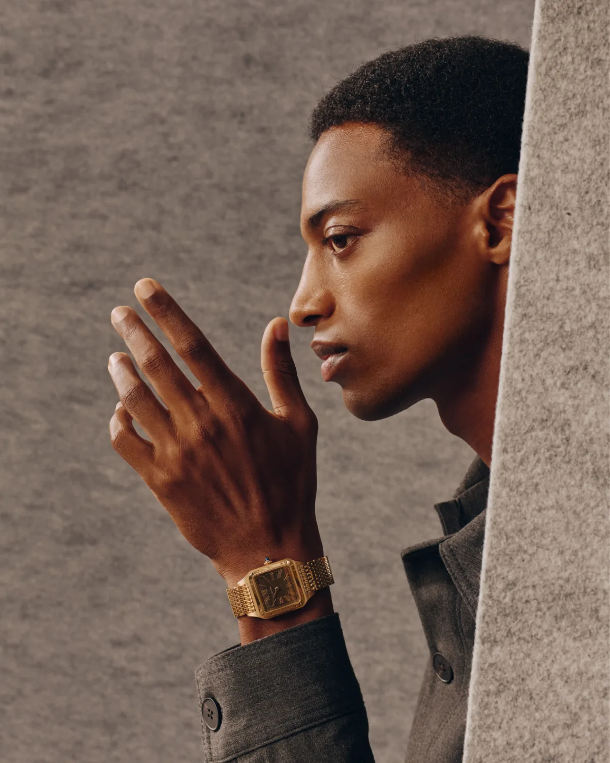Side profile of Cartier Santos-Dumont watch under shirt cuff