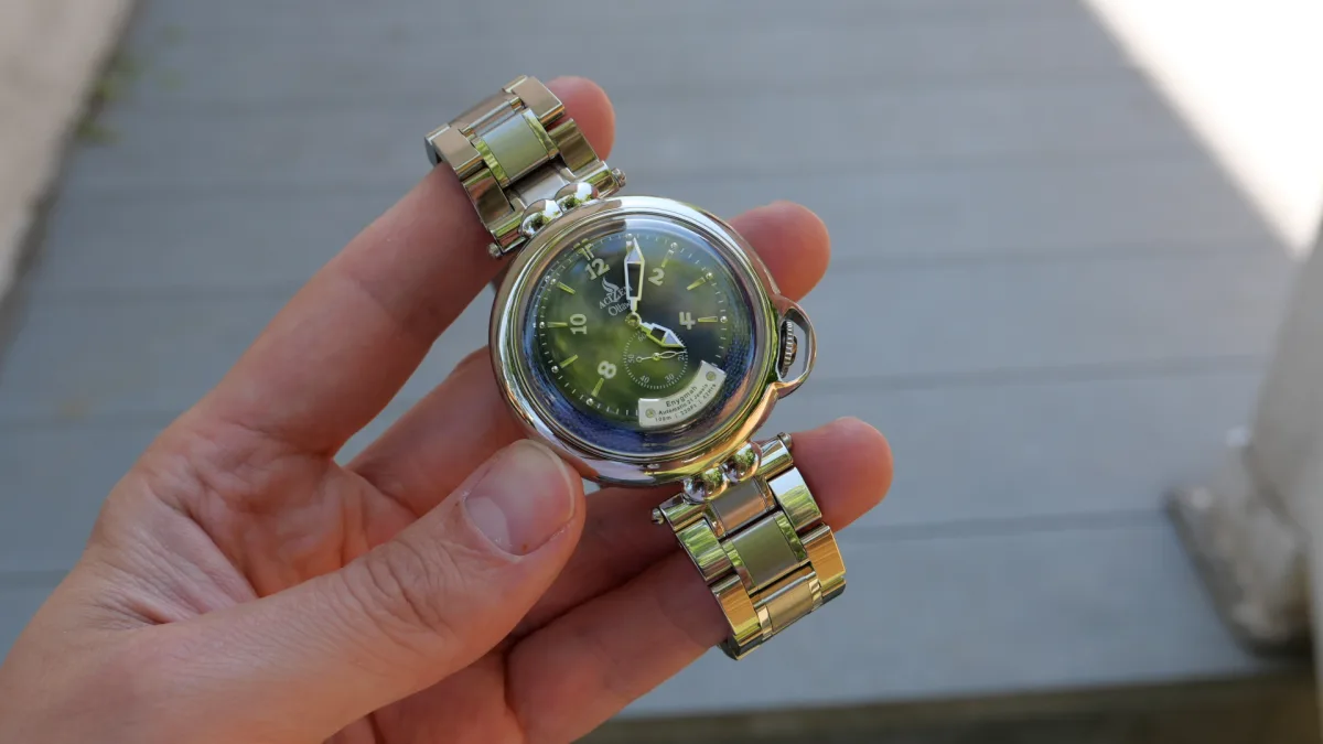 Detailed view of the Enygmah's dial with radial brushing and subdial.