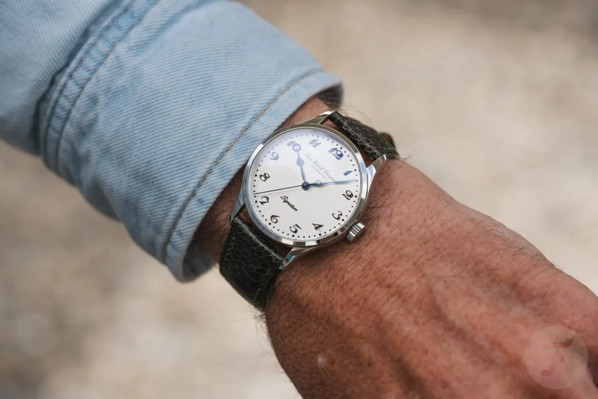 Sero Silver Signature watch with silver dial on a display stand