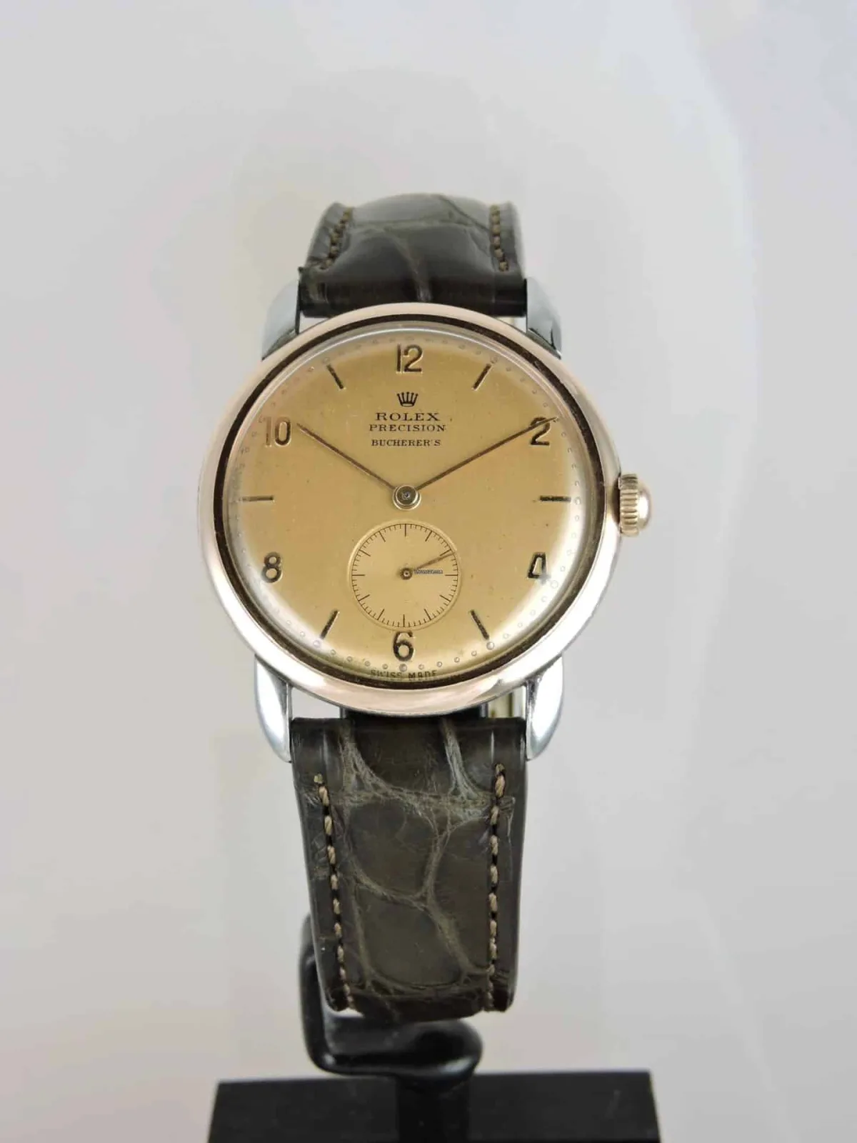 Rolex Precision watch with double signing by Bucherer, showcasing dual branding.