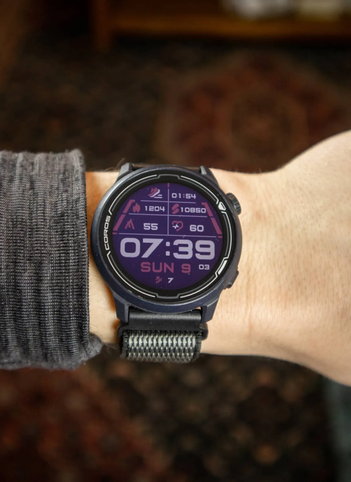 Nine budget smartwatch models displayed on a table.