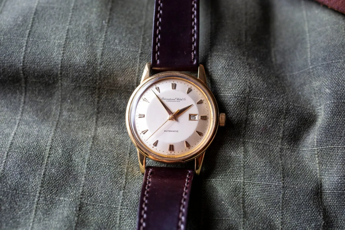 Vintage IWC watch with leather strap and silver dial