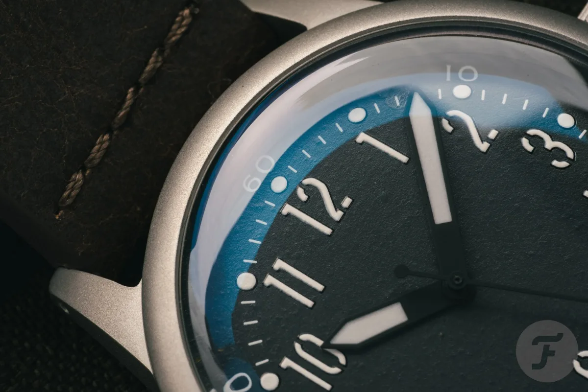 Close-up of olive drab and red oxide paint on A-11 LMUV dial