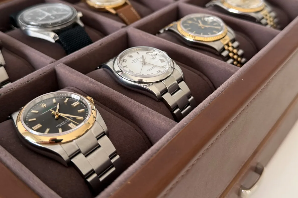 Gold bezel and crown details on Rolex OP100