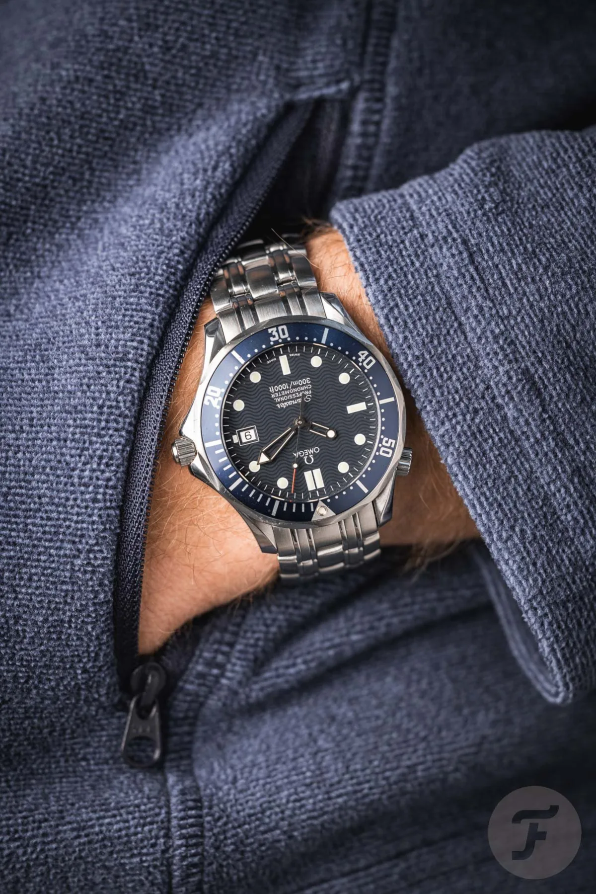 Close-up of Omega Seamaster Professional 300M's wave-pattern dial