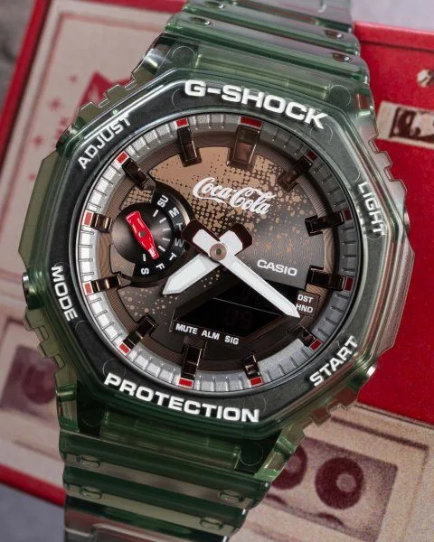 Vintage Coca-Cola bottle and Casio G-Shock