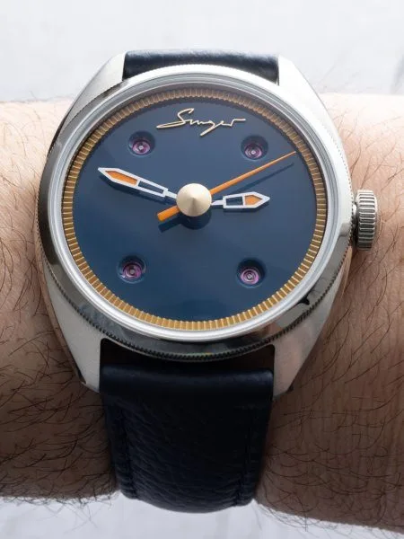 Side view of Caballero watch showcasing polished steel case