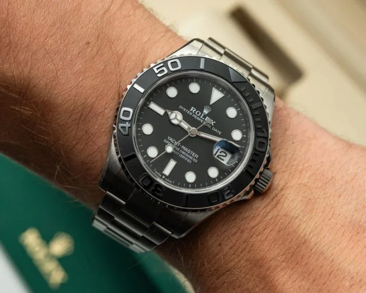 Watch enthusiasts examining watches