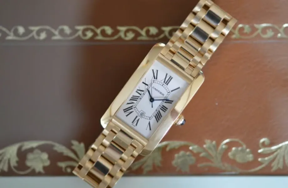 Luxury watches displayed in a store window during summer sales