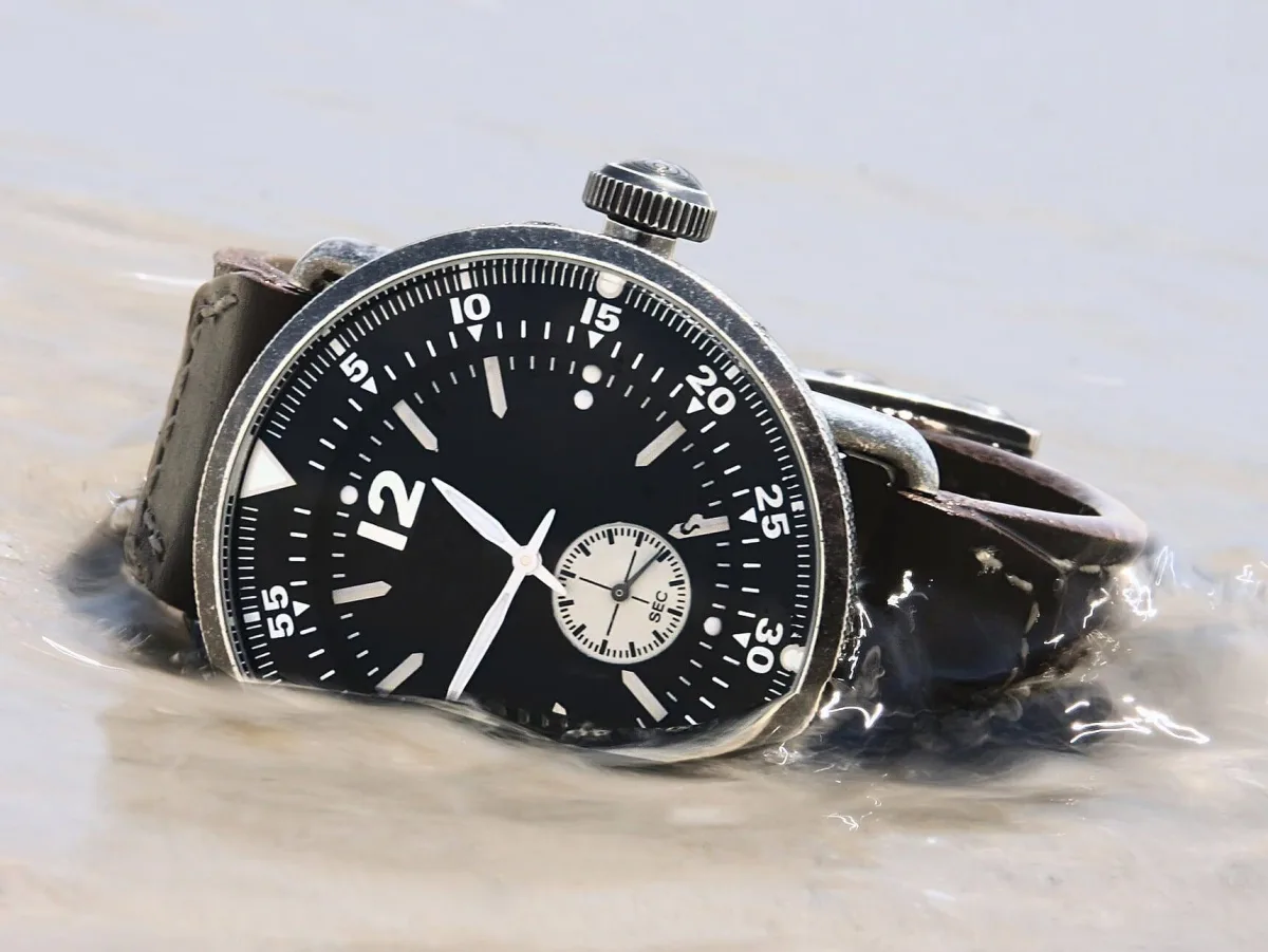 Close-up of a diver's watch face, illustrating water resistance.
