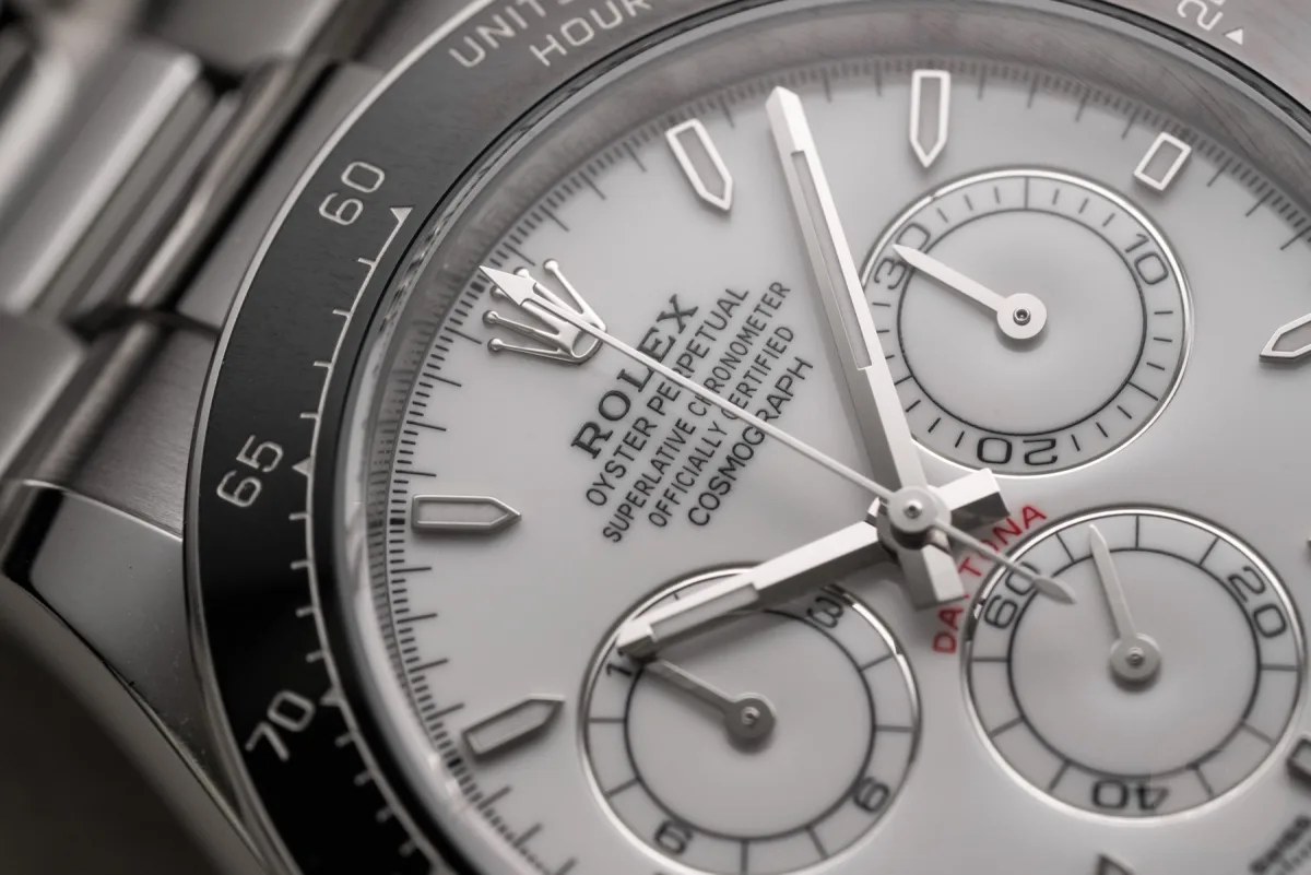 Dark gray ceramic bezel with white enamel dial