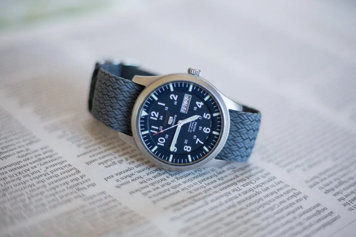 Seiko 5 SNZG watch on a rugged terrain