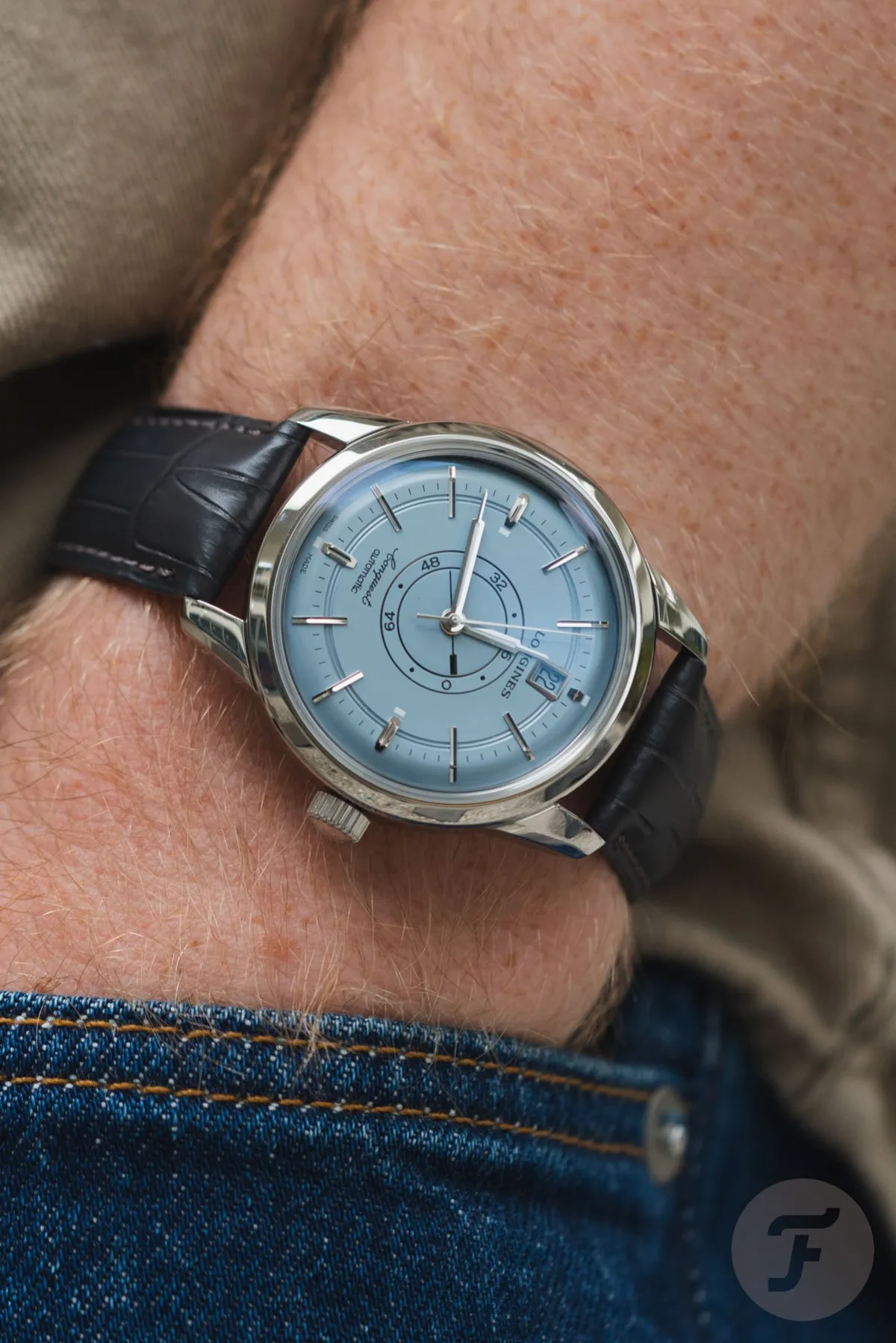 Longines Conquest watch with blue accessories