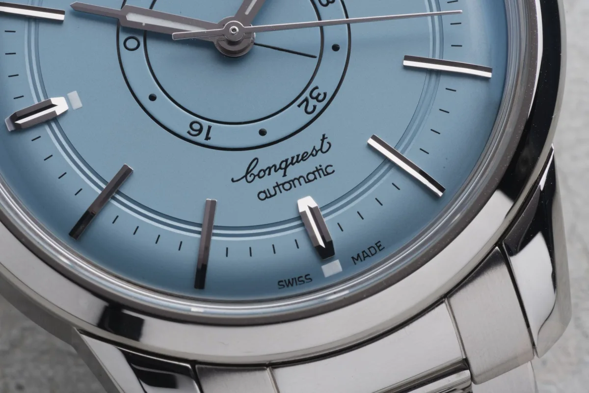 Classic design elements of Longines watch including date window