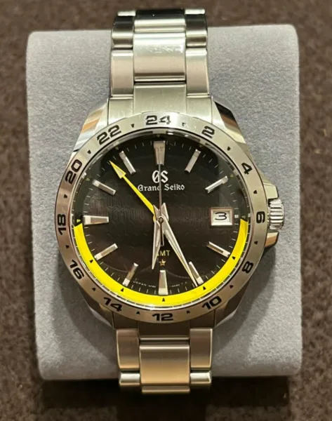 Grand Seiko SBGN001 quartz model with yellow accents