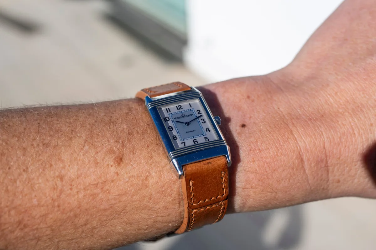 Stylish shot of Jaeger-LeCoultre Reverso watch in silver.