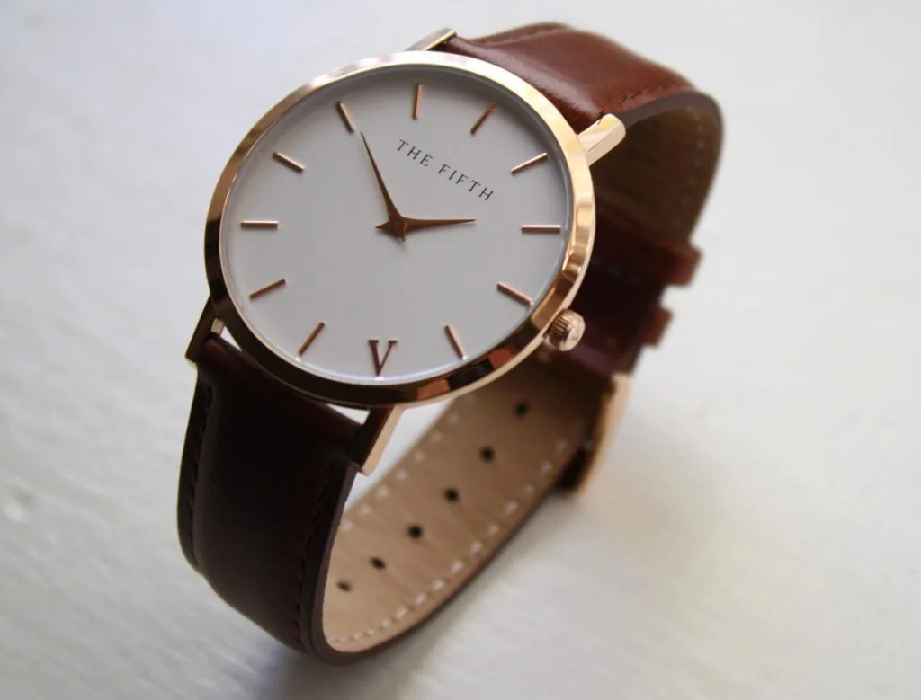 Brown leather strap watch with a simple dial