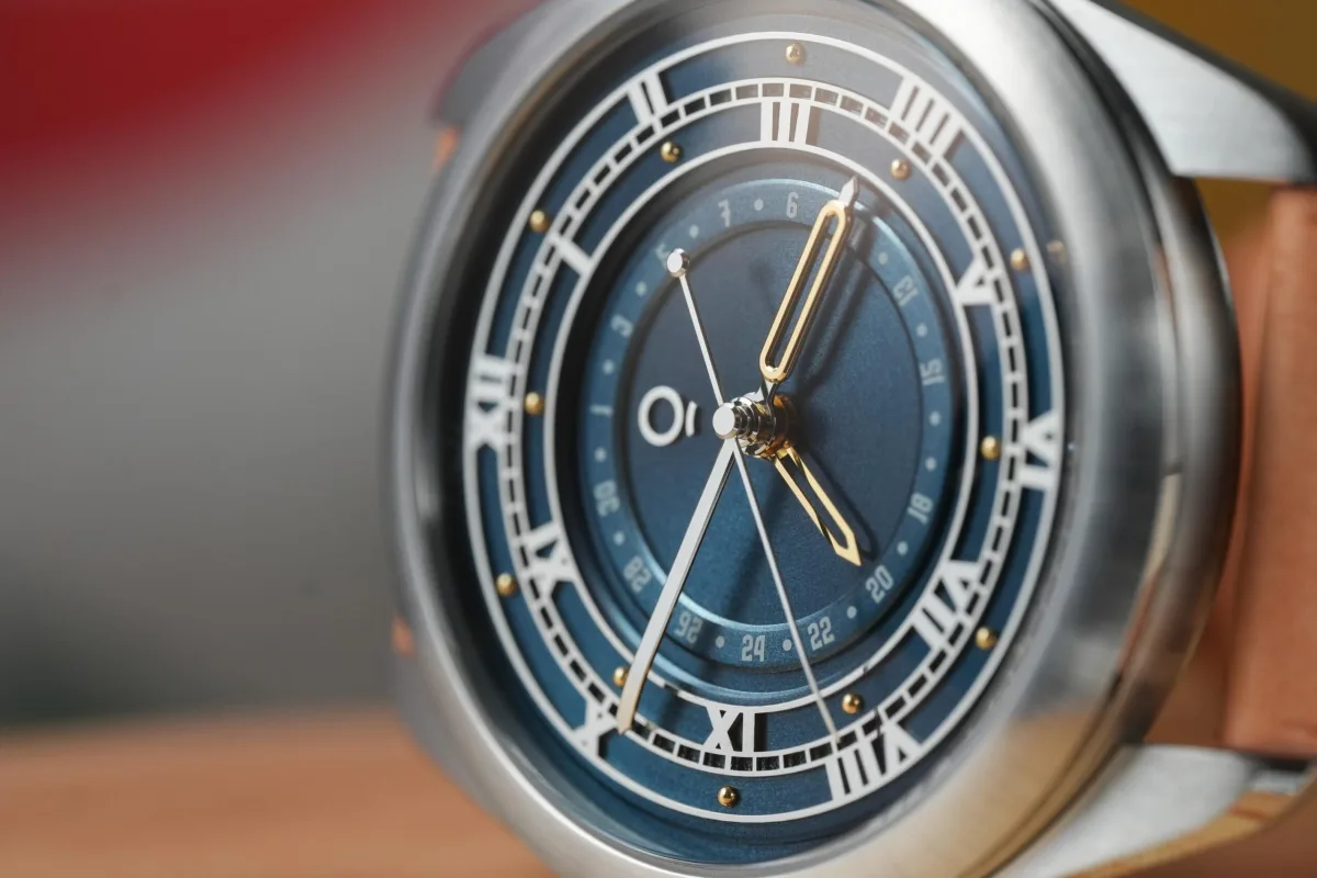 Close-up of OraOrea watch hands and dial design
