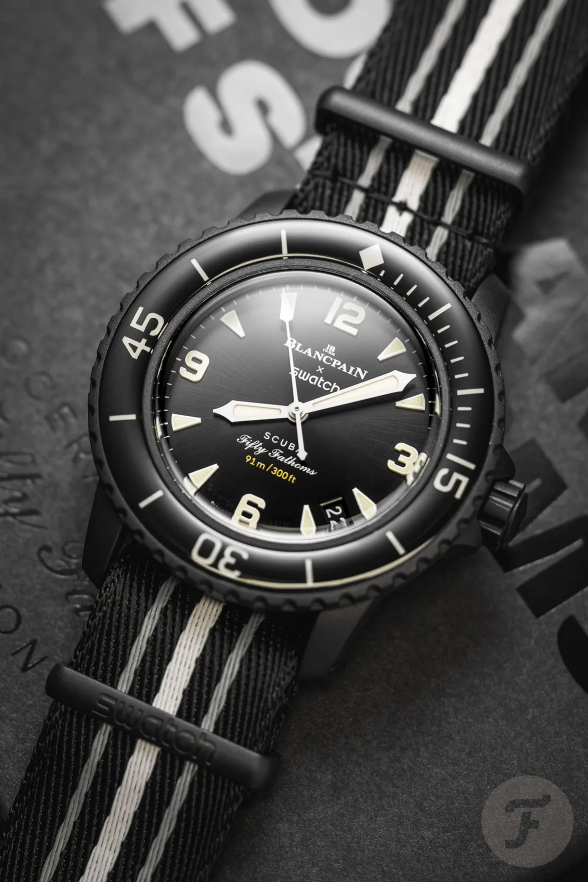 Luminescence of Swatch Scuba Fifty Fathoms under low light